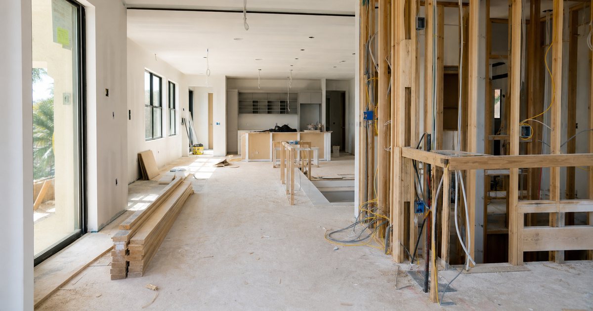 When should whole-home automation be planned during a luxury home construction project?